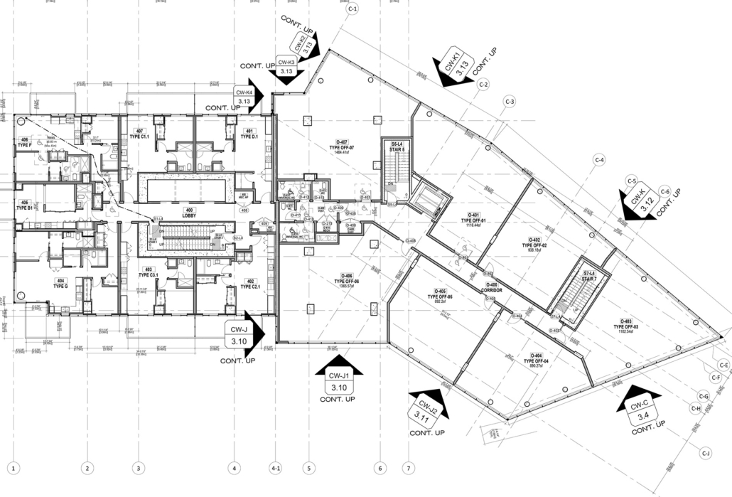 Black and white architectural floor plan showing multiple rooms, staircases, labeled areas, and structural details, with annotations, measurements, and symbols marking key features and floor levels throughout the layout.
